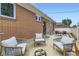 Inviting patio featuring brick exterior and lounge furniture, ideal for relaxing outdoors at 10712 Larson Dr, Northglenn, CO 80233
