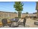 Outdoor patio area with table, chairs, and decorative brick wall, perfect for entertaining at 10712 Larson Dr, Northglenn, CO 80233