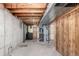 Unfinished basement featuring utilities, exposed ceiling, and concrete flooring at 2336 S Dawson Way, Aurora, CO 80014