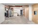 Unfinished basement with exposed utilities, shelving, and stairs offers room to expand at 2336 S Dawson Way, Aurora, CO 80014