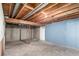 Unfinished basement with exposed wood beams and concrete walls; personalize to your taste at 2336 S Dawson Way, Aurora, CO 80014
