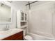 Bright bathroom with a white vanity, tub, and subway tile at 2336 S Dawson Way, Aurora, CO 80014