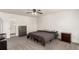 Spacious bedroom with a ceiling fan and adjacent bathroom creates a comfy and convenient space at 2336 S Dawson Way, Aurora, CO 80014