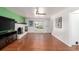Bright living room features hardwood floors, a fireplace, and large window offering plenty of natural light at 2336 S Dawson Way, Aurora, CO 80014