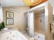 Bathroom featuring a soaking tub, a separate shower, and neutral tile; perfect for relaxation at 28268 Shadow Mountain Dr, Conifer, CO 80433