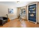 Bright bedroom featuring a blue bookcase, a desk, and natural light from a window at 28268 Shadow Mountain Dr, Conifer, CO 80433