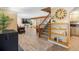 Welcoming entryway with staircase, open floor plan, and stylish decor elements at 28268 Shadow Mountain Dr, Conifer, CO 80433