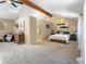 Spacious bedroom featuring a vaulted ceiling, accent lighting, and neutral paint at 28268 Shadow Mountain Dr, Conifer, CO 80433