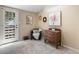 Inviting room features a black accent chair, a decorative wreath, and soft natural light at 28268 Shadow Mountain Dr, Conifer, CO 80433