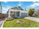 Charming single-Gathering home with a well-manicured lawn and inviting front porch at 7647 Elmwood St, Littleton, CO 80125