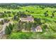 Expansive home with an oversized lot surrounded by mature trees providing privacy at 4725 Palmer Ridge Dr, Parker, CO 80134