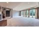 Spacious carpeted basement with recessed lighting, large windows, and walk-out access to the outdoors at 4725 Palmer Ridge Dr, Parker, CO 80134