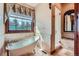Elegant bathroom featuring a standalone tub, a glass enclosed shower, and a large window at 4725 Palmer Ridge Dr, Parker, CO 80134
