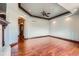 Bright living room with an archway, recessed lighting, and hardwood floors at 4725 Palmer Ridge Dr, Parker, CO 80134