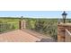 Relax on your private deck featuring stone columns, steel railing, and stunning views of the valley at 4725 Palmer Ridge Dr, Parker, CO 80134