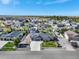 Wide aerial shot showcasing the expansive neighborhood and the well-manicured landscaping around the home at 525 Remington Dr, Hudson, CO 80642