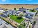 A tranquil aerial view features a home, a large barn, garden, and well-kept backyard at 525 Remington Dr, Hudson, CO 80642