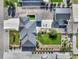 An aerial view of a backyard featuring a well-kept lawn, a barn, and landscaping at 525 Remington Dr, Hudson, CO 80642
