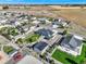 Aerial view of a community showcasing homes with large lots, barns, landscaping, and parking at 525 Remington Dr, Hudson, CO 80642