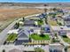 An aerial perspective highlights a home with a big yard, a spacious barn, and garden area at 525 Remington Dr, Hudson, CO 80642