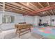 Unfinished basement with a foosball table, exercise equipment, and potential for personalization at 525 Remington Dr, Hudson, CO 80642