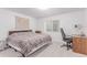 A standard bedroom with carpeted floors, a window with blinds and a small closet at 525 Remington Dr, Hudson, CO 80642