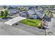 Aerial view of a beautifully landscaped single-Gathering home with a three-car garage at 525 Remington Dr, Hudson, CO 80642
