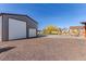 Spacious garage with a large roll-up door, perfect for storage or workshop use at 525 Remington Dr, Hudson, CO 80642