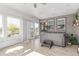 Sunroom with floor to ceiling windows and a hot tub at 525 Remington Dr, Hudson, CO 80642