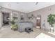 Sunroom featuring a hot tub, decorative shelving, and bright natural light at 525 Remington Dr, Hudson, CO 80642