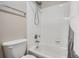 Bright bathroom featuring a shower over tub with white tile and a silver shower head at 55410 E 27Th Pl, Strasburg, CO 80136