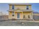 Charming two-story home with a welcoming front porch and well-maintained yard at 55410 E 27Th Pl, Strasburg, CO 80136