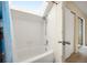 Bright bathroom features a skylight above the tub and shower at 17093 E Tennessee Dr # 211, Aurora, CO 80017
