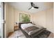 Comfortable bedroom with a ceiling fan, neutral tones, and ample natural light at 17093 E Tennessee Dr # 211, Aurora, CO 80017