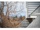 Mountain view featuring the bare branches of a winter tree, as well as light blue sky at 17093 E Tennessee Dr # 211, Aurora, CO 80017