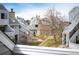 Scenic view from balcony featuring a well-maintained courtyard with mature trees and walking path at 17093 E Tennessee Dr # 211, Aurora, CO 80017