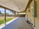 Spacious covered back porch with exterior storage and a large yard at 235 S Stuart St, Denver, CO 80219