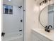Bathroom featuring a tiled shower and modern fixtures at 235 S Stuart St, Denver, CO 80219