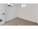Finished basement bedroom with neutral carpet, trim and white walls at 235 S Stuart St, Denver, CO 80219