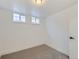 Finished basement bedroom with neutral carpet, trim and white walls at 235 S Stuart St, Denver, CO 80219