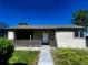 Charming single-story home with a cozy front porch and well-maintained lawn at 235 S Stuart St, Denver, CO 80219
