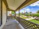 Covered front porch offers a relaxing outdoor space with views of the landscaped front yard at 235 S Stuart St, Denver, CO 80219