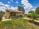 Quaint single-story house with a screened-in porch and well-kept front lawn at 235 S Stuart St, Denver, CO 80219