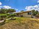 Charming single-story home with a well-maintained lawn and mature landscaping at 235 S Stuart St, Denver, CO 80219