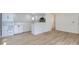 Open-concept living space features pristine white walls and modern flooring at 235 S Stuart St, Denver, CO 80219