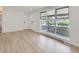 Sunlit living area featuring expansive windows with views of the landscaped front yard at 235 S Stuart St, Denver, CO 80219