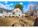 Backyard with patio, solar panels, and lush lawn at 2254 S Eagle St, Aurora, CO 80014