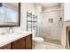 Stylish bathroom with updated vanity, glass-enclosed shower, and modern fixtures at 2254 S Eagle St, Aurora, CO 80014