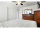 Minimalist bedroom with a soft, cozy bed and dark wood furniture for a serene feel at 2254 S Eagle St, Aurora, CO 80014