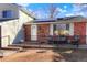 Inviting front porch featuring a cozy seating area, with solar panels, and a welcoming entrance at 2254 S Eagle St, Aurora, CO 80014